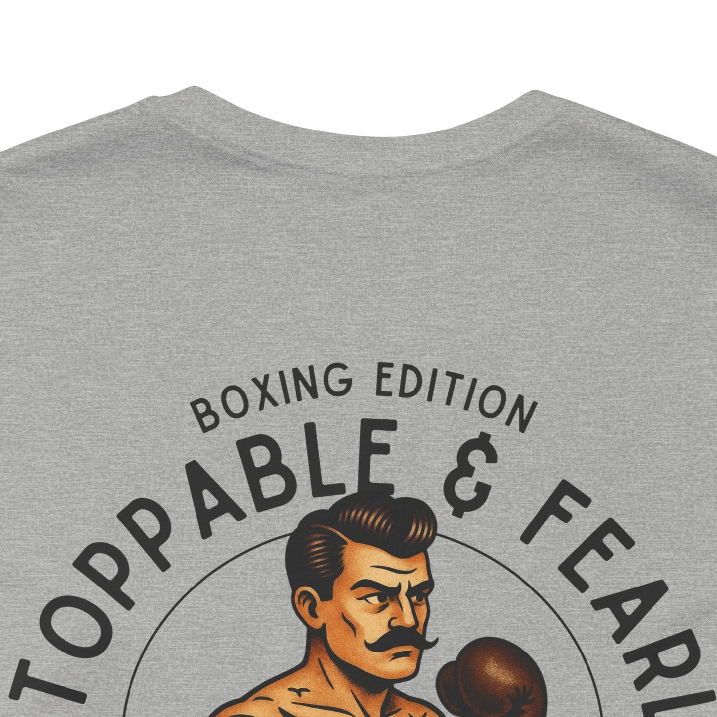 Gray t-shirt with boxing-themed graphic and text on a white background
