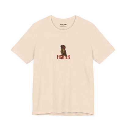 Beige t-shirt with a minimalistic graphic of an owl and the word 'FIGHTER'