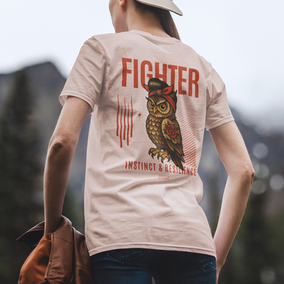 Person wearing a t-shirt with an owl graphic and text, standing outdoors.
