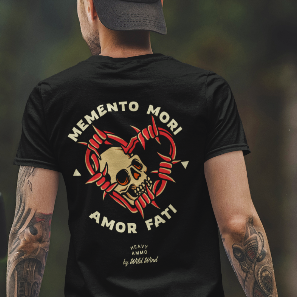 Person wearing a black t-shirt with a skull design. Stoic choice.